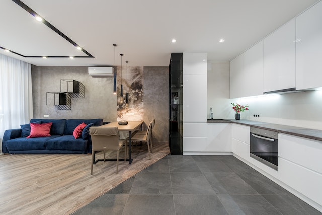 Open plan living room with designated kitchen space