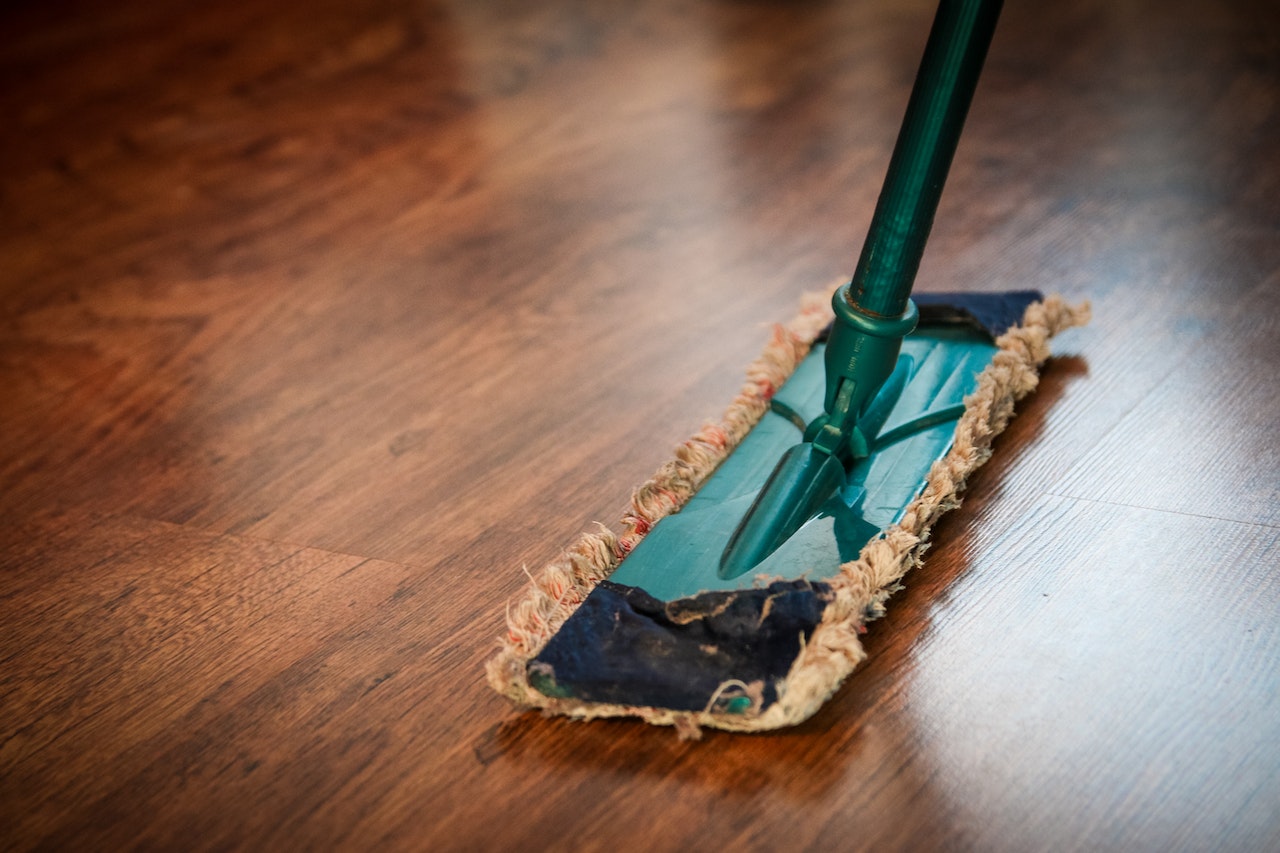 A person mopping a floor.