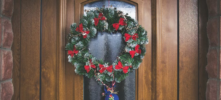 A Christmas wreath on the door.